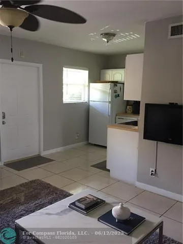 a kitchen with a sink a stove cabinets and a counter top space