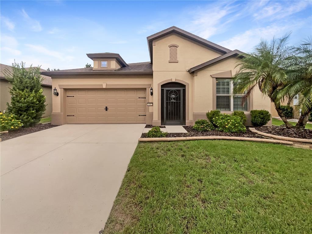 6482 Southwest 97th Terrace Road Ocala, FL 34481 - Photo 1 of 1 a front view of a house with garage