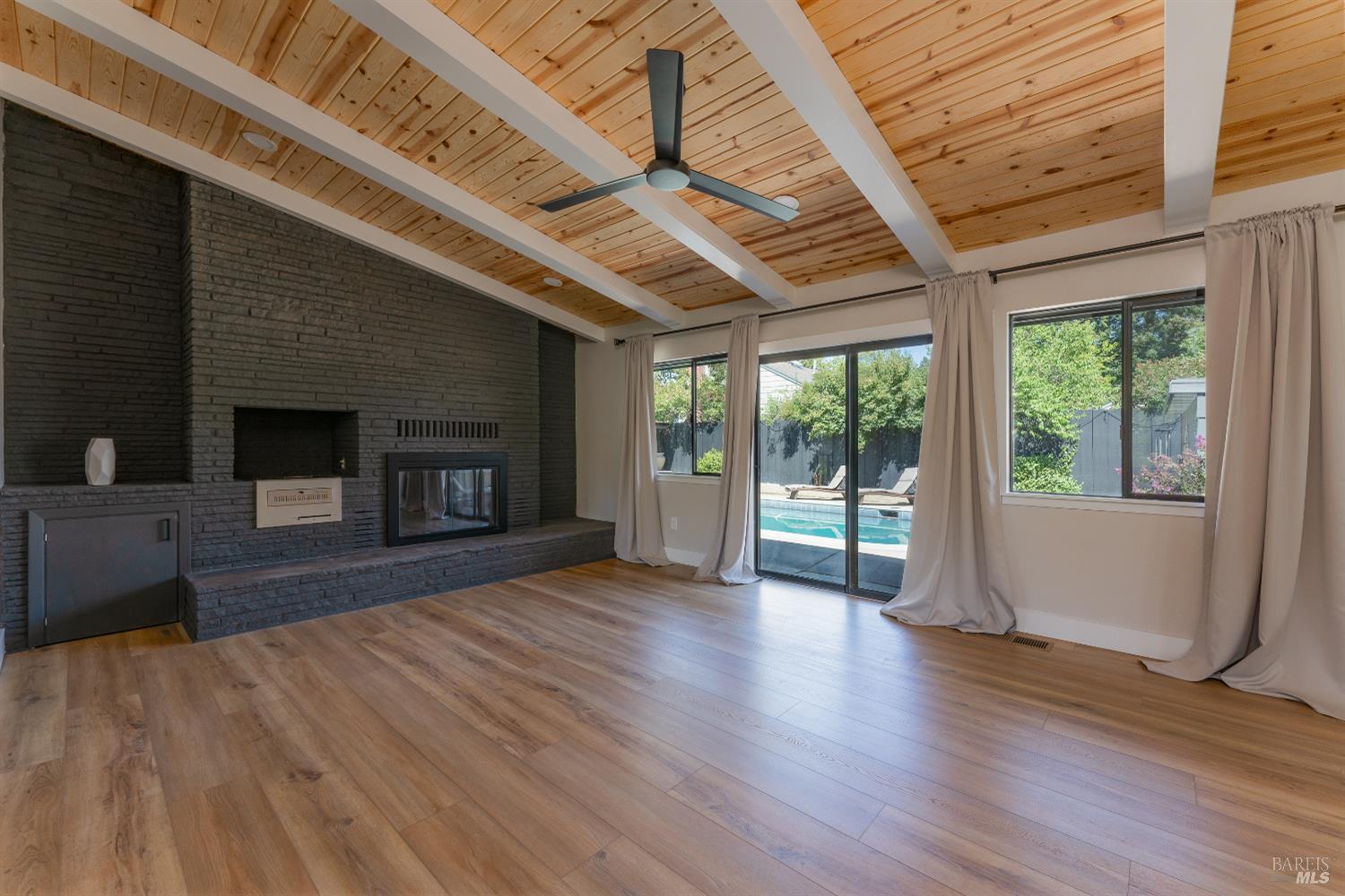 788 Walnut Avenue Ukiah, CA 95482 - Photo 15 of 36 a view of empty room with wooden floor and fireplace