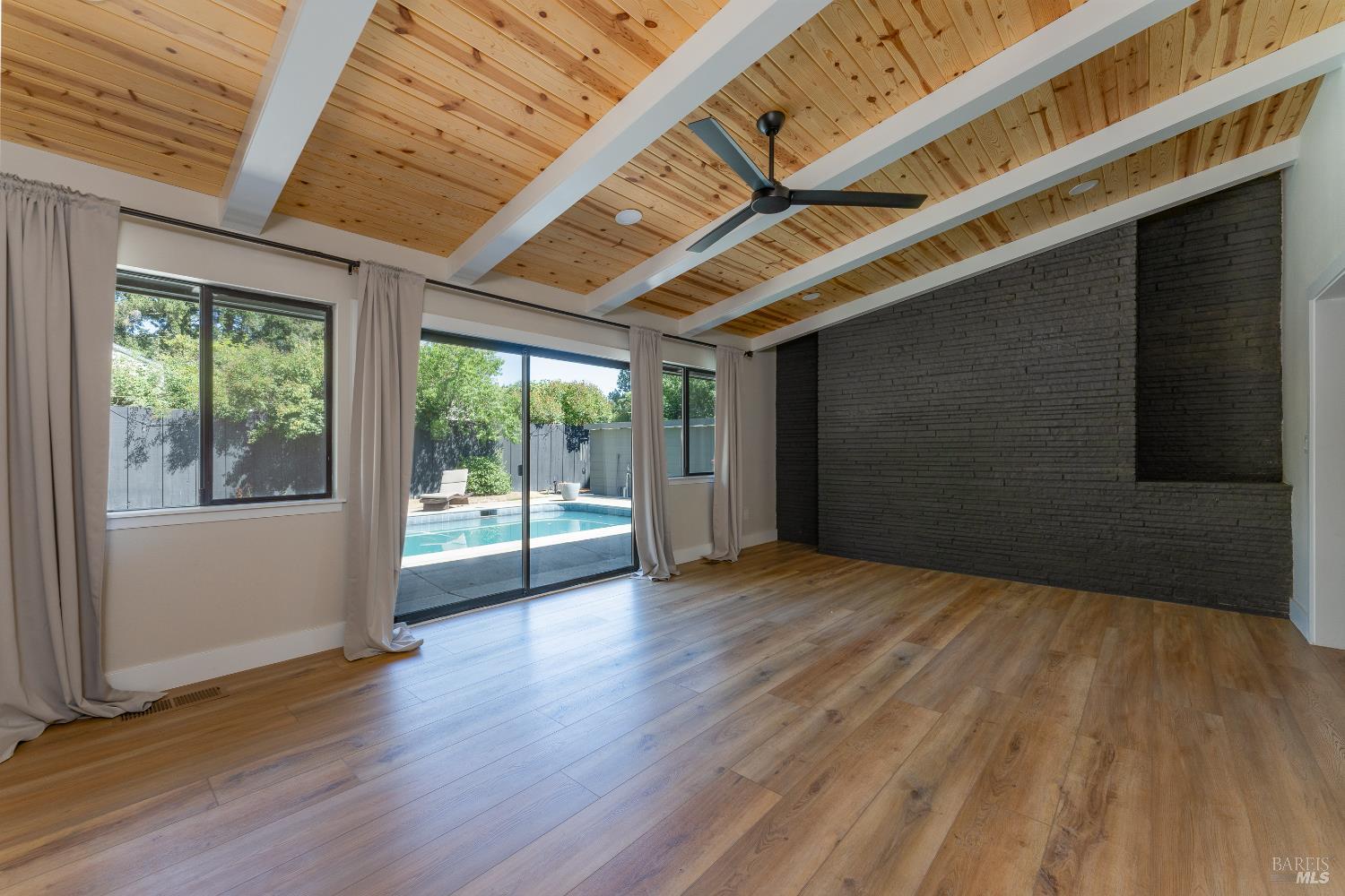 788 Walnut Avenue Ukiah, CA 95482 - Photo 17 of 36 a view of an empty room with wooden floor and a window