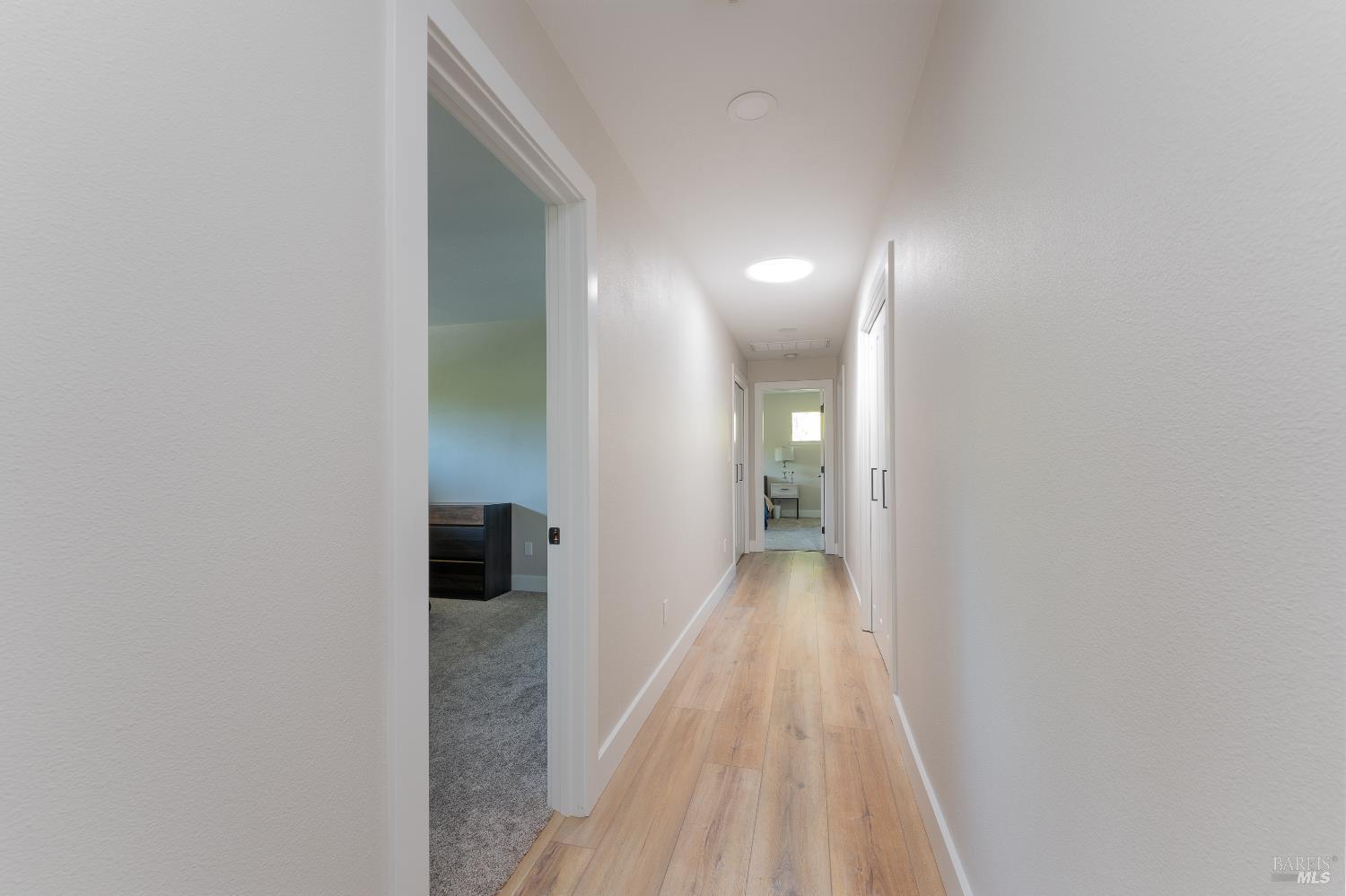 788 Walnut Avenue Ukiah, CA 95482 - Photo 26 of 36 a view of a hallway with wooden floor