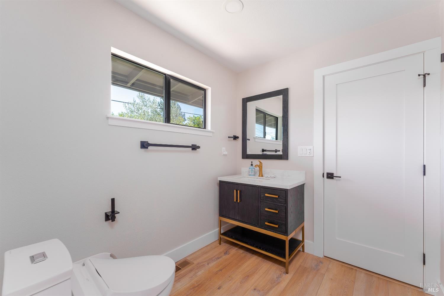 788 Walnut Avenue Ukiah, CA 95482 - Photo 28 of 36 a bathroom with a toilet sink and mirror