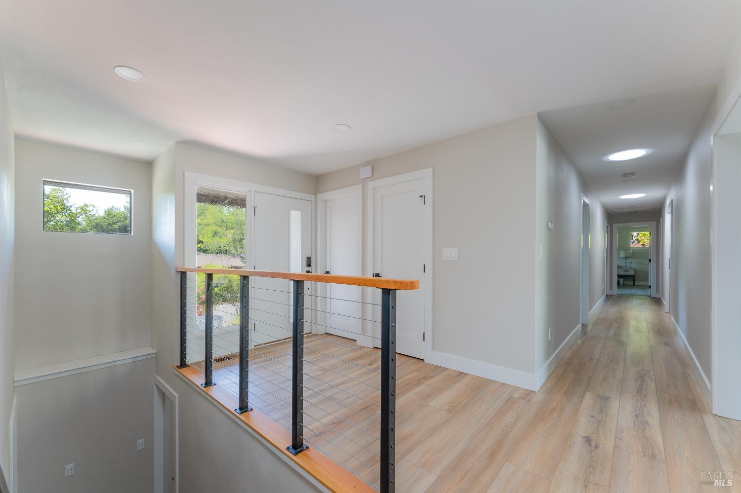 788 Walnut Avenue Ukiah, CA 95482 - Photo 30 of 36 a view of a hallway with wooden floor and staircase