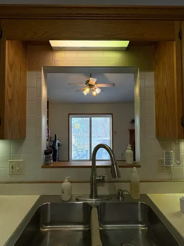 a kitchen with a sink and a stove