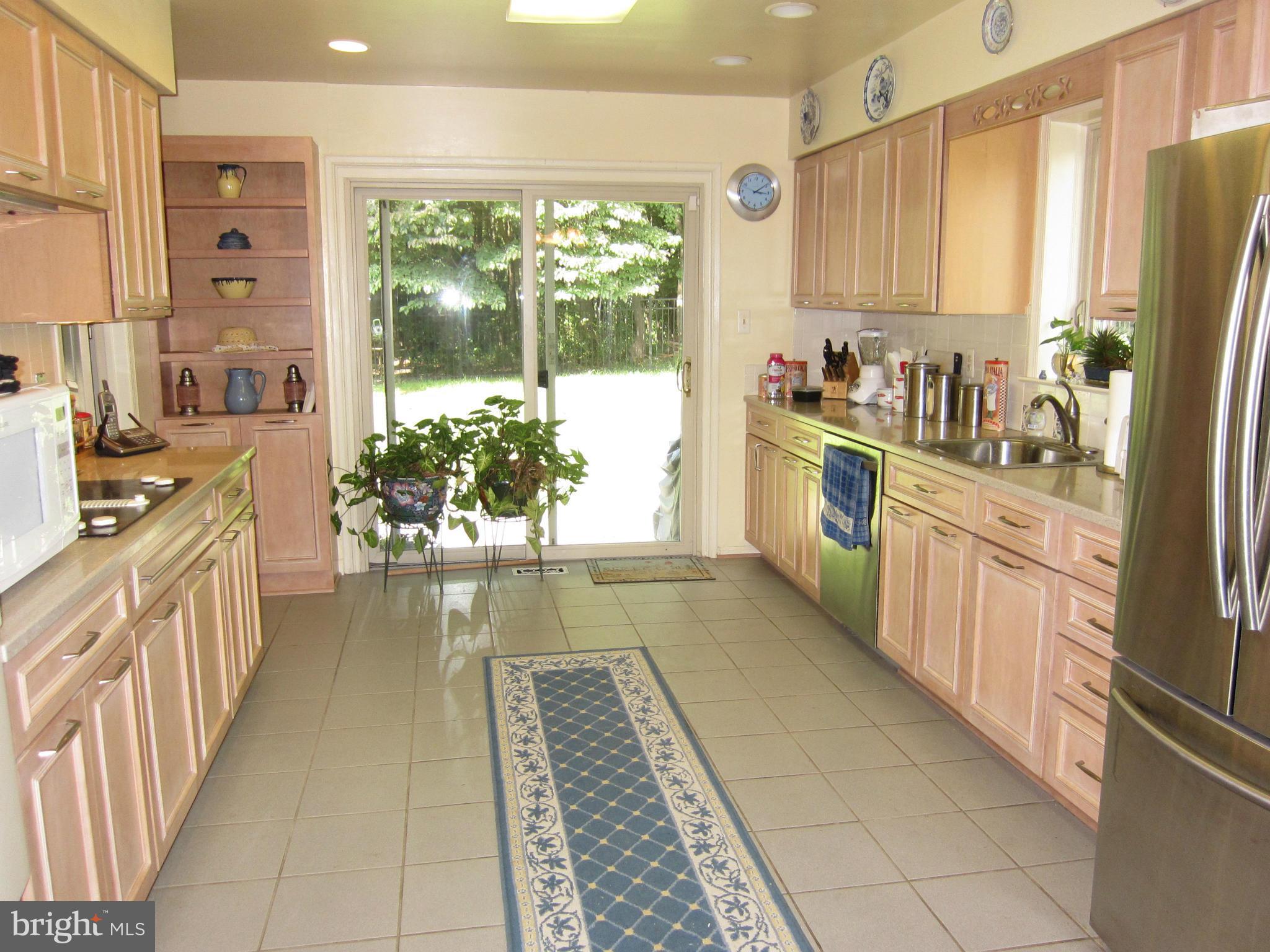 15212 Winstead Lane Silver Spring, MD 20905 - Photo 9 of 30 Kitchen with sliders to patio, rear yard