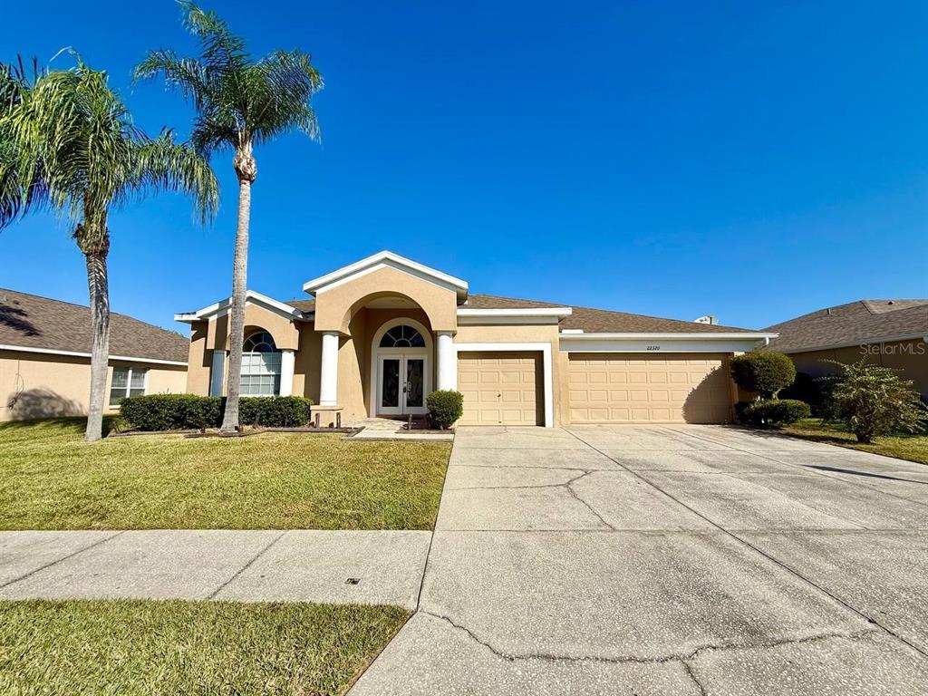 a view of a street with a yard