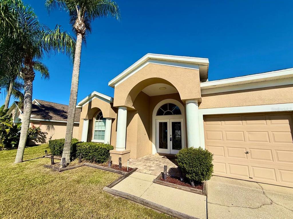 22320 Red Jacket Lane Land O' Lakes, FL 34639 - Photo 2 of 35 a front view of a house with a yard