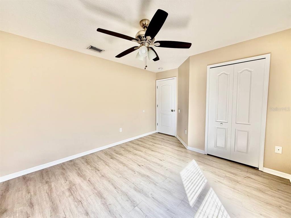 22320 Red Jacket Lane Land O' Lakes, FL 34639 - Photo 29 of 35 a view of a room with a ceiling fan