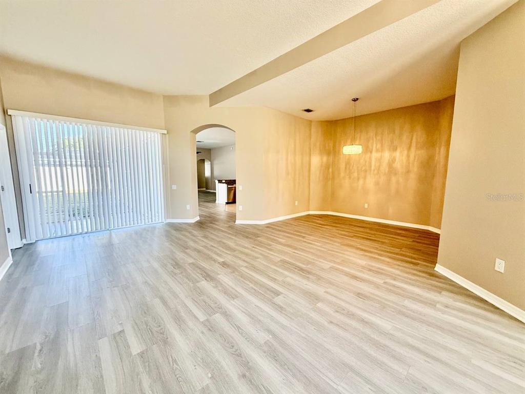 22320 Red Jacket Lane Land O' Lakes, FL 34639 - Photo 4 of 35 a view of a livingroom with wooden floor