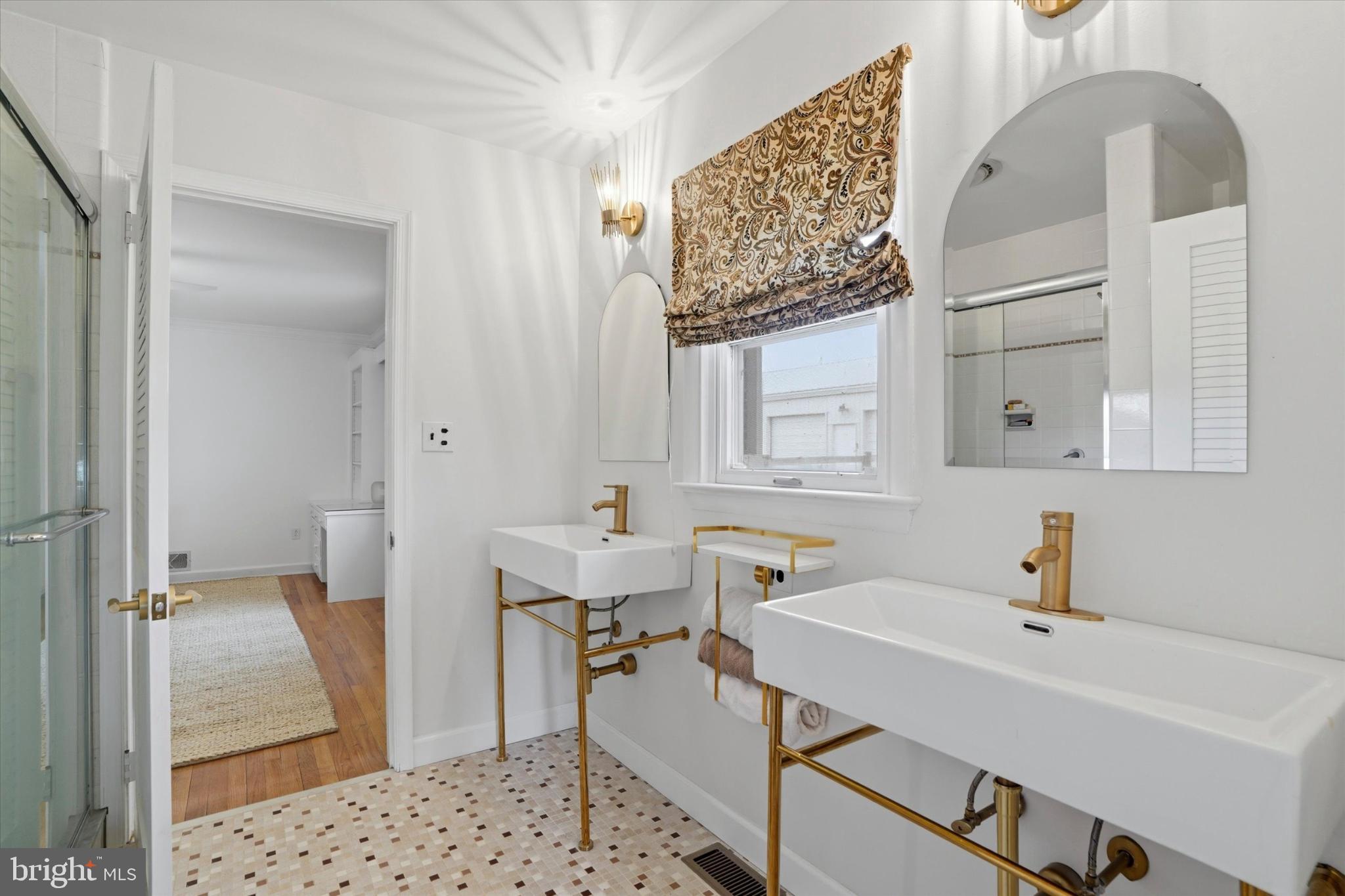 875 Locust Grove Road West Chester, PA 19382 - Photo 27 of 44 a bathroom with a sink and a mirror