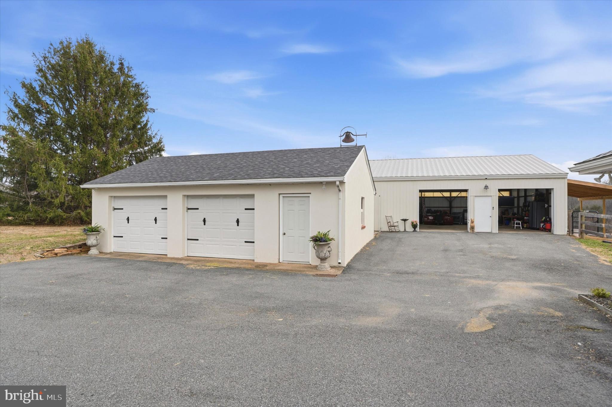 875 Locust Grove Road West Chester, PA 19382 - Photo 34 of 44 a view of a white house with a large space and a large tree