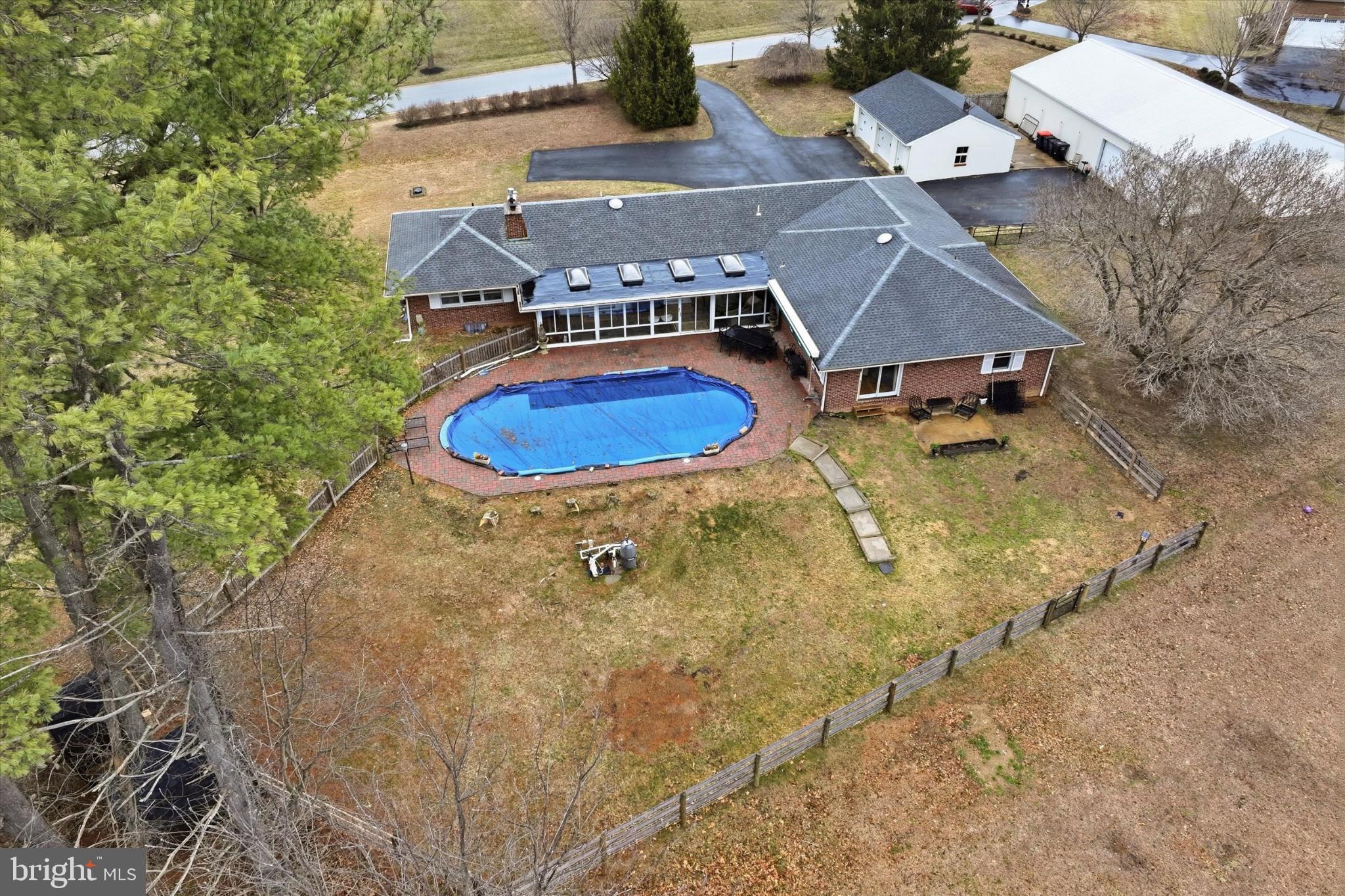 875 Locust Grove Road West Chester, PA 19382 - Photo 41 of 44 an aerial view of a house with swimming pool and yard