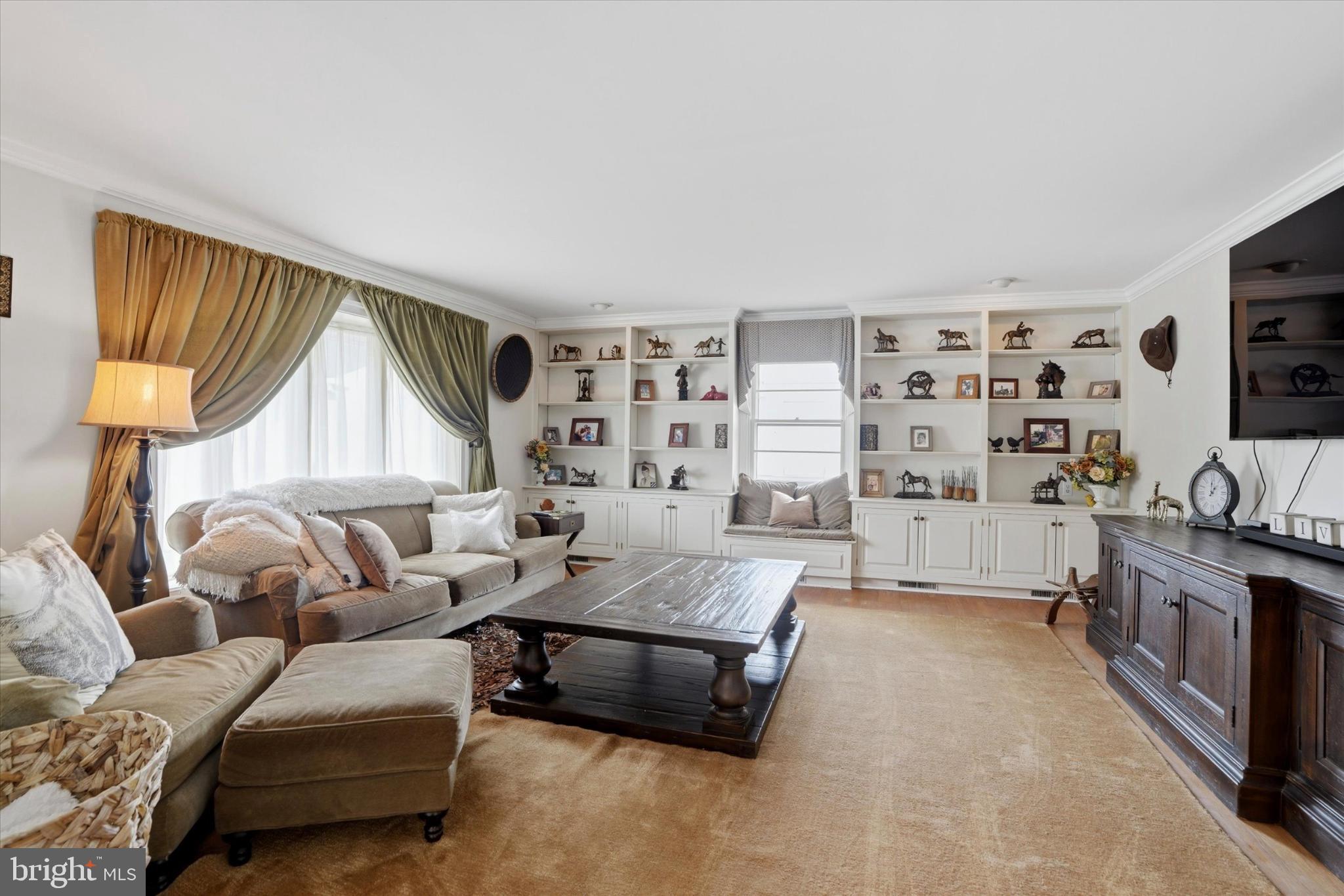 875 Locust Grove Road West Chester, PA 19382 - Photo 6 of 44 a living room with furniture and a flat screen tv
