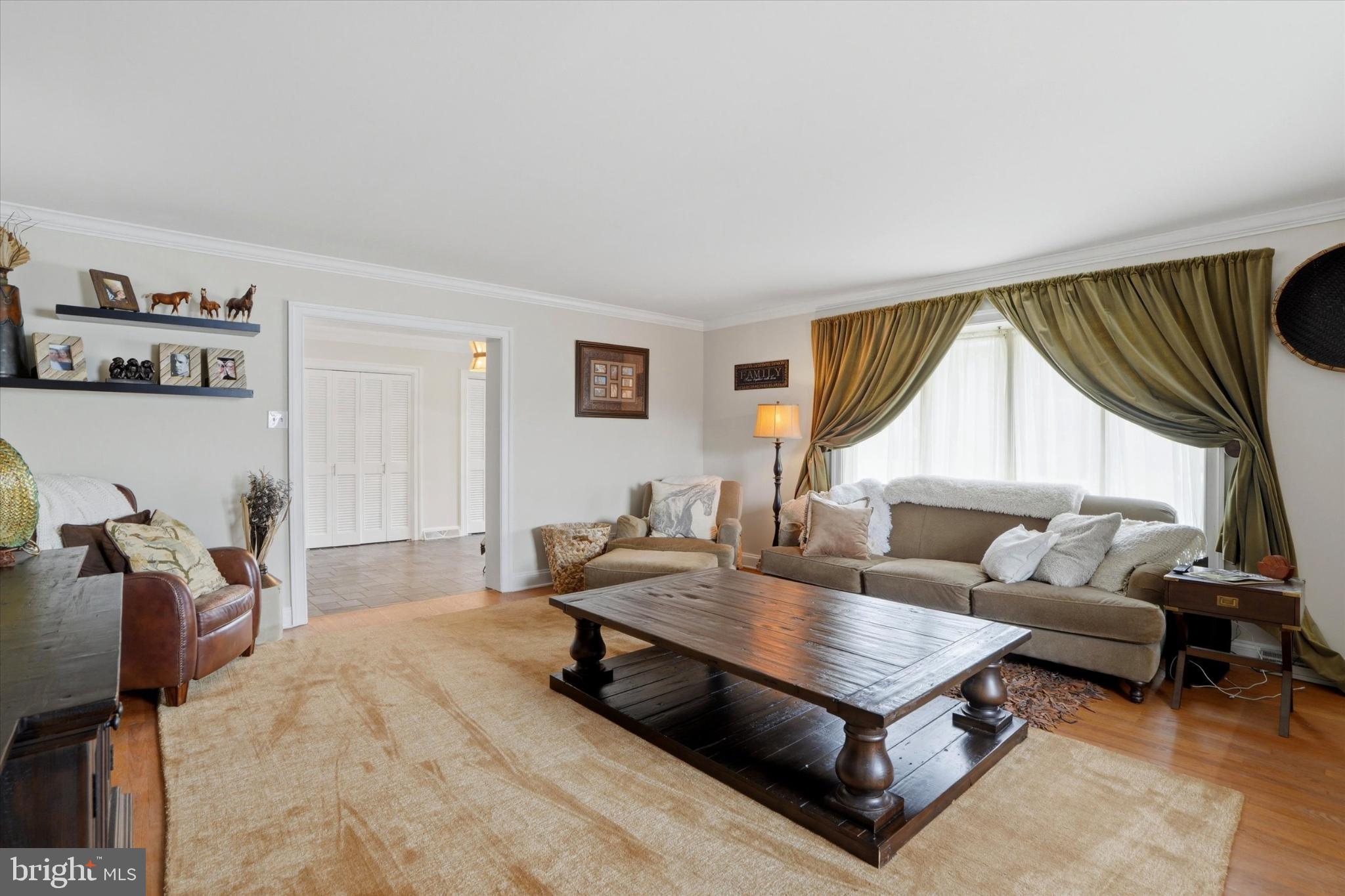 875 Locust Grove Road West Chester, PA 19382 - Photo 7 of 44 a living room with furniture and a large window