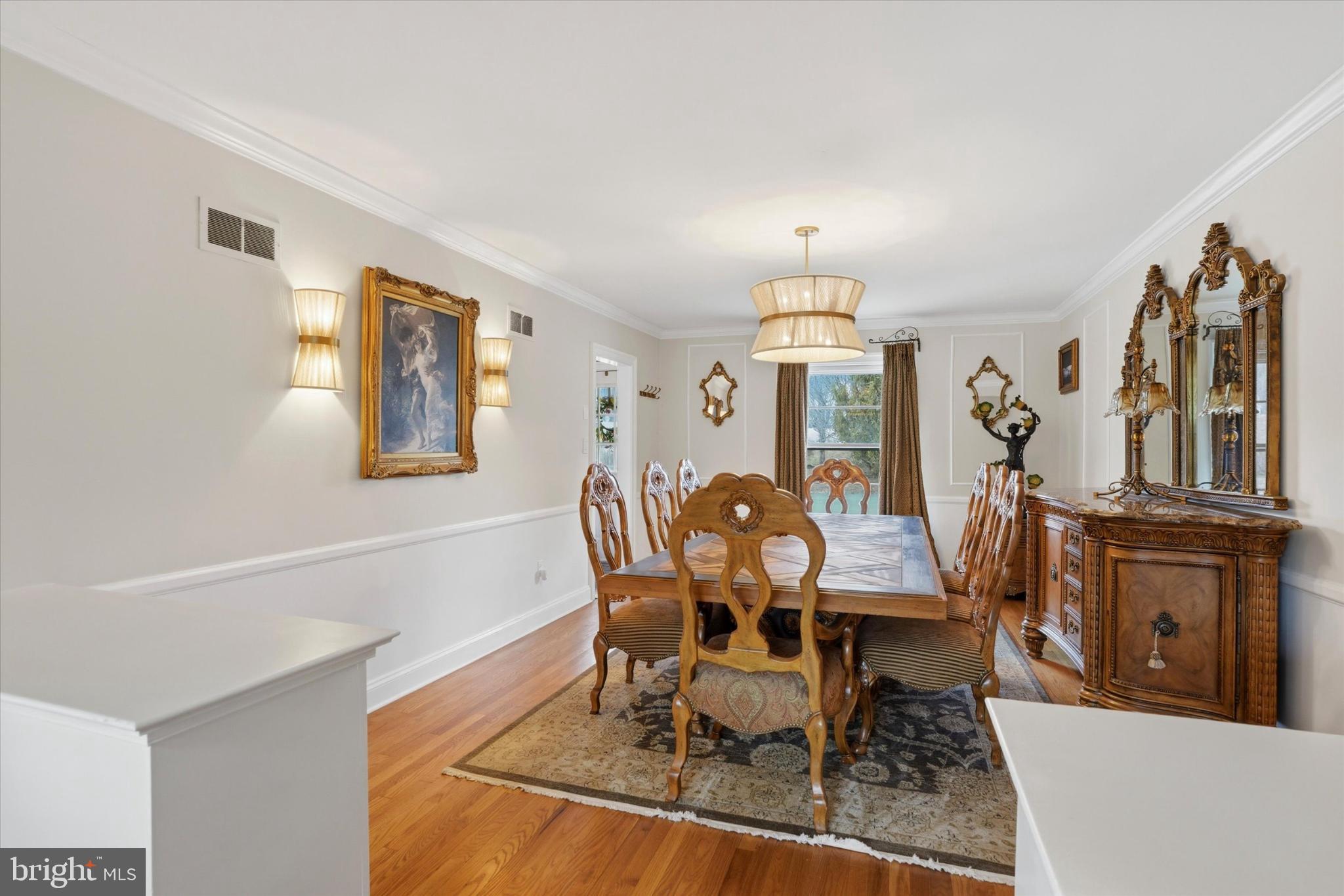 875 Locust Grove Road West Chester, PA 19382 - Photo 9 of 44 a view of a dining room with furniture and a chandelier