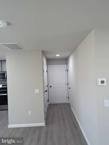 a view of a livingroom with wooden floor