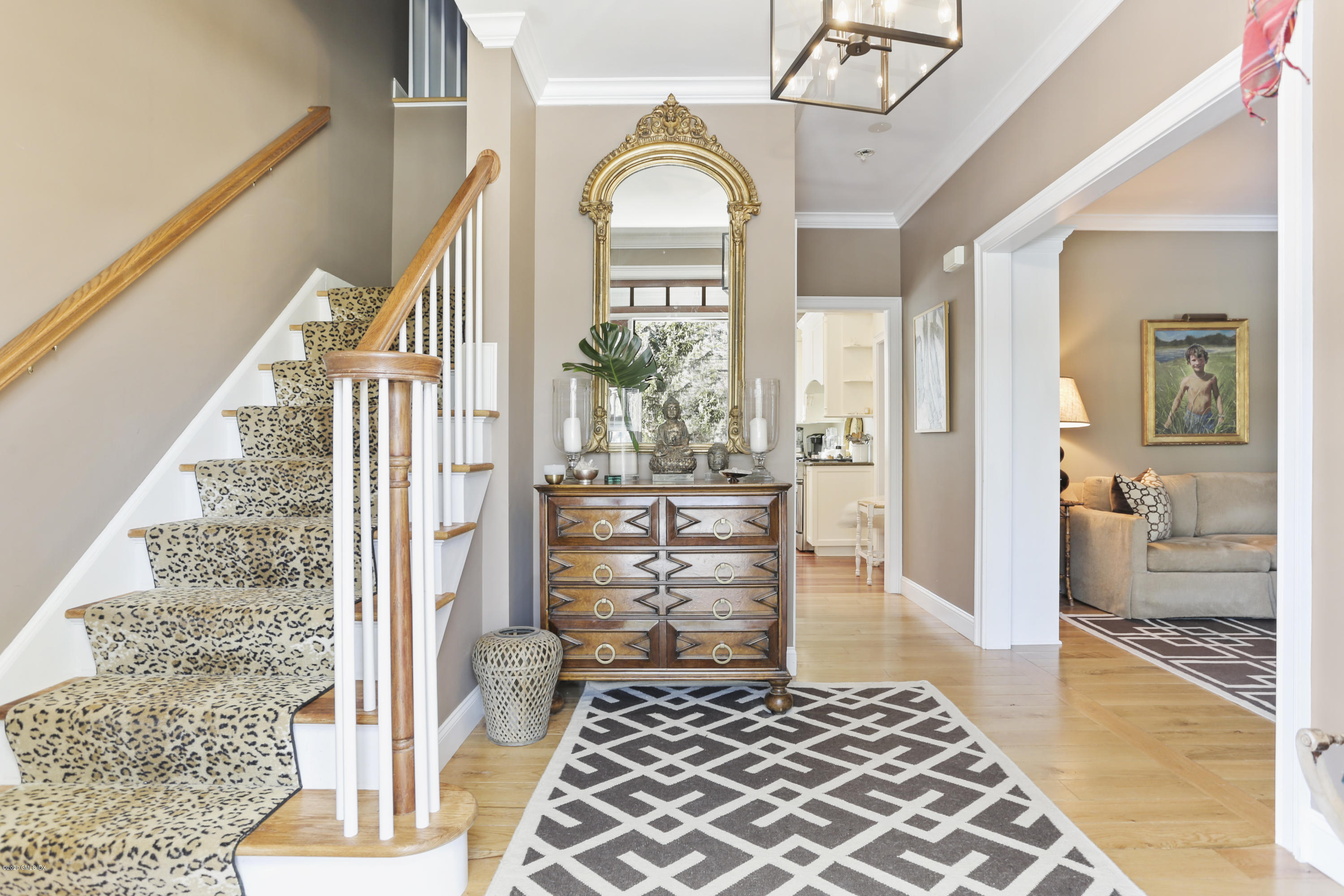 184 Cat Rock Road Cos Cob, CT 06807 - Photo 6 of 25 a view of a hallway to a livingroom with furniture