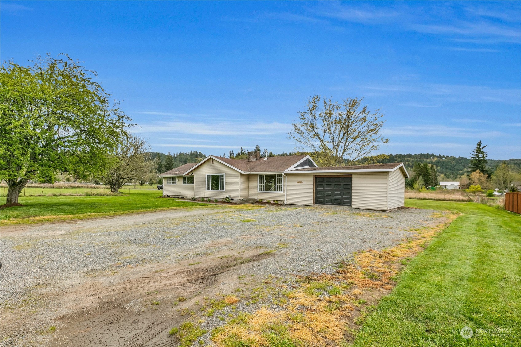 2093 Ryan Road Buckley, WA 98321 - Photo 1 of 25 a front view of a house with a yard and garage