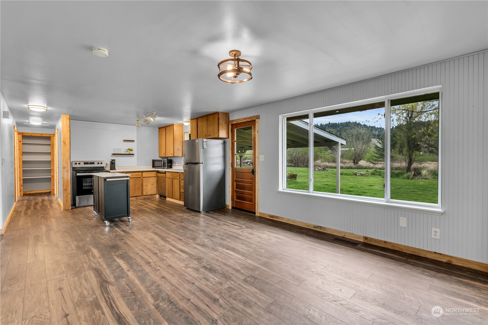 2093 Ryan Road Buckley, WA 98321 - Photo 11 of 25 a kitchen with stainless steel appliances granite countertop a refrigerator a stove and a wooden floors