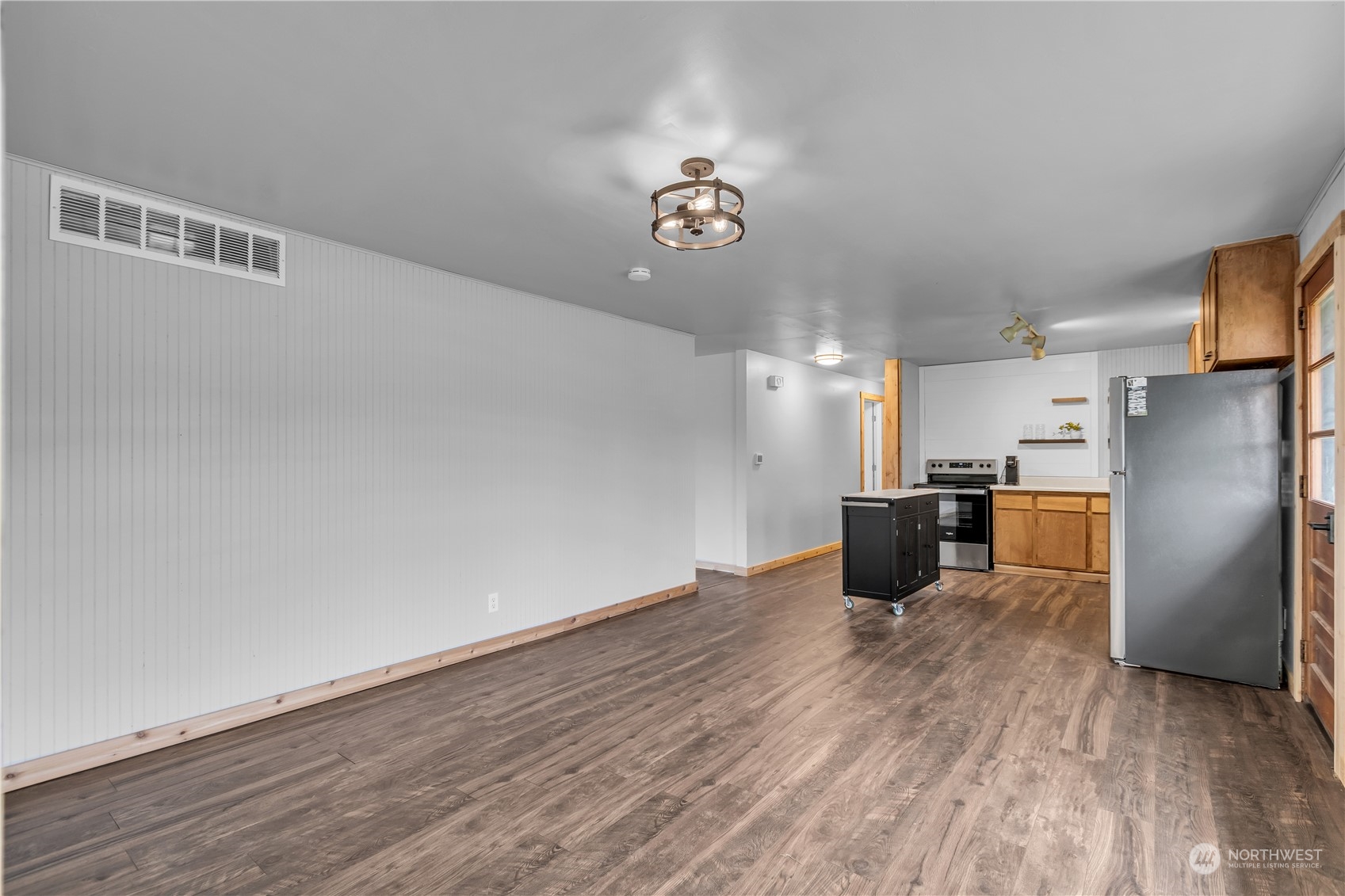 2093 Ryan Road Buckley, WA 98321 - Photo 12 of 25 a kitchen with stainless steel appliances a refrigerator and a wooden floor