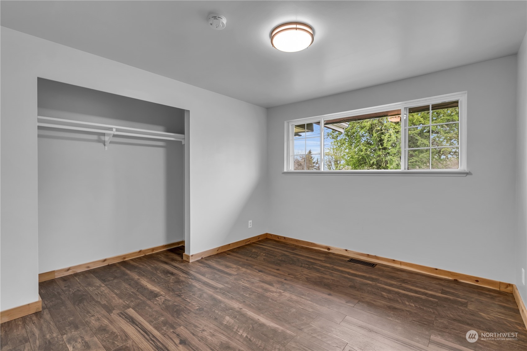 2093 Ryan Road Buckley, WA 98321 - Photo 16 of 25 a view of empty room with wooden floor and fan