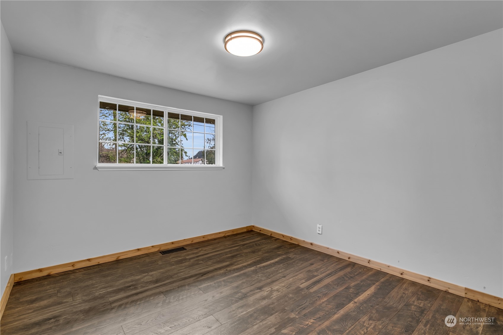 2093 Ryan Road Buckley, WA 98321 - Photo 17 of 25 wooden floor in an empty room with a window