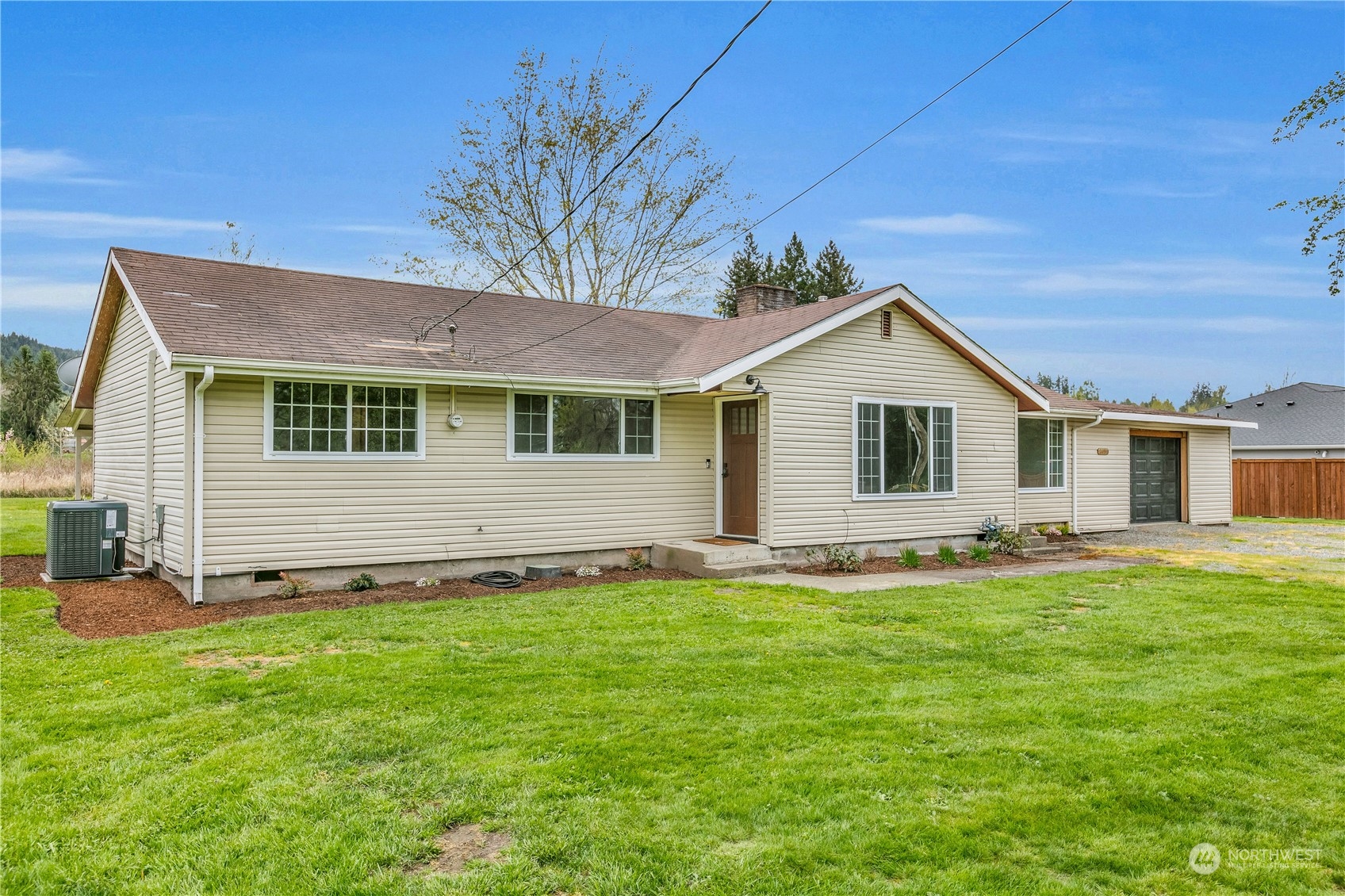 2093 Ryan Road Buckley, WA 98321 - Photo 2 of 25 a front view of a house with a garden
