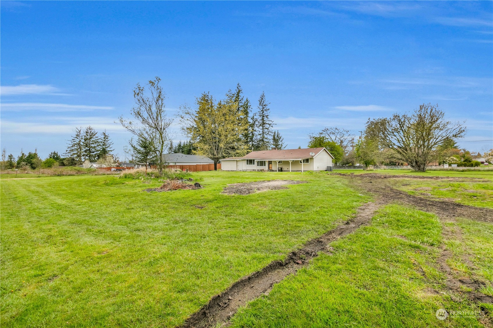 2093 Ryan Road Buckley, WA 98321 - Photo 21 of 25 a garden with trees in the background