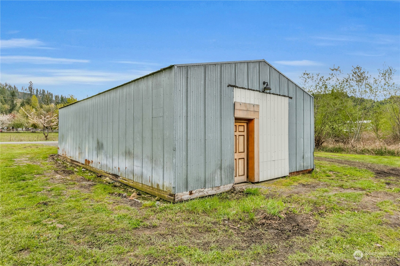 2093 Ryan Road Buckley, WA 98321 - Photo 23 of 25 a backyard of a house with wooden fence