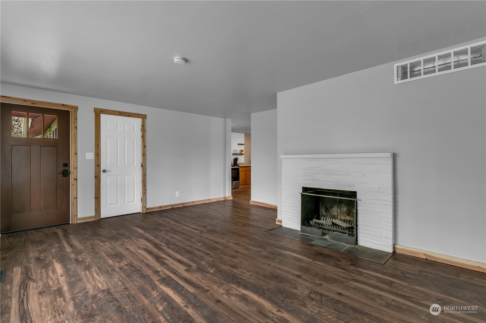 2093 Ryan Road Buckley, WA 98321 - Photo 5 of 25 a view of empty room with wooden floor and fireplace