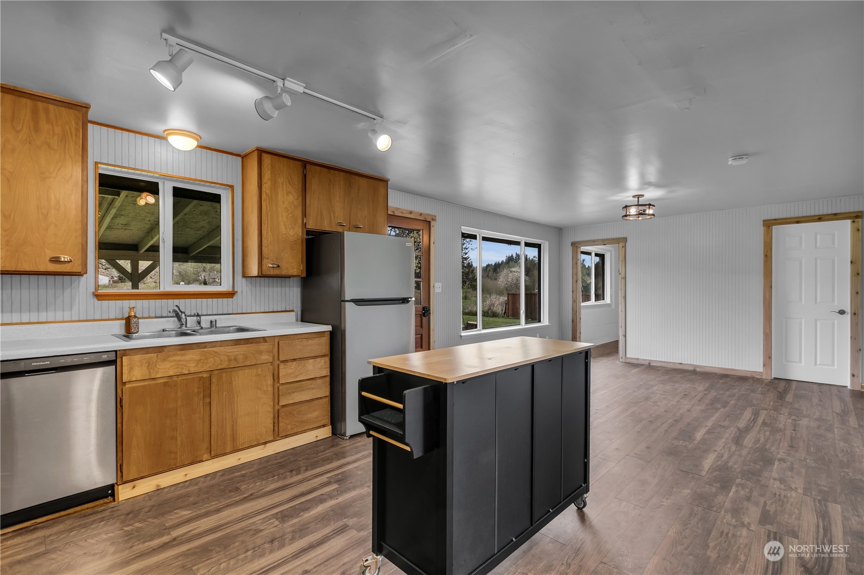 2093 Ryan Road Buckley, WA 98321 - Photo 7 of 25 a kitchen with refrigerator cabinets and wooden floor