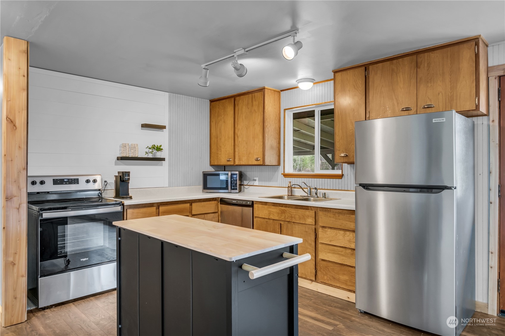2093 Ryan Road Buckley, WA 98321 - Photo 8 of 25 a kitchen with stainless steel appliances a refrigerator a sink a stove and cabinets