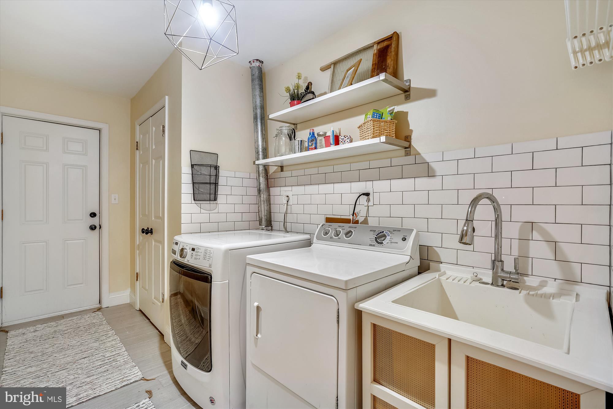 3270 Bottner Road Gambrills, MD 21054 - Photo 43 of 54 Laundry room features subway tile and utility sink