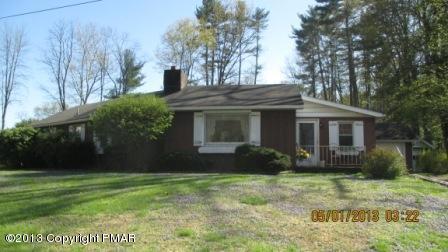 231 Tanite Road Stroudsburg, PA 18360 - Photo 1 of 14 a front view of a house with a yard