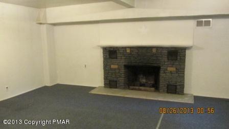 231 Tanite Road Stroudsburg, PA 18360 - Photo 12 of 14 a view of an empty room with a fireplace