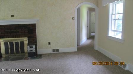 231 Tanite Road Stroudsburg, PA 18360 - Photo 2 of 14 a view of a livingroom with an empty space and a fireplace