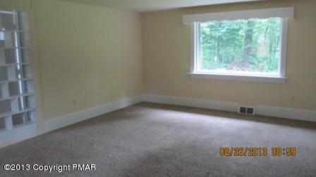 231 Tanite Road Stroudsburg, PA 18360 - Photo 3 of 14 an empty room with a window