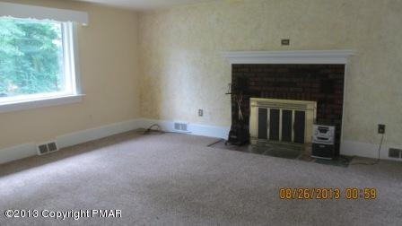 231 Tanite Road Stroudsburg, PA 18360 - Photo 4 of 14 a view of an empty room with a fireplace