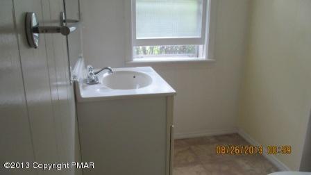 231 Tanite Road Stroudsburg, PA 18360 - Photo 7 of 14 a bathroom with a sink and mirror