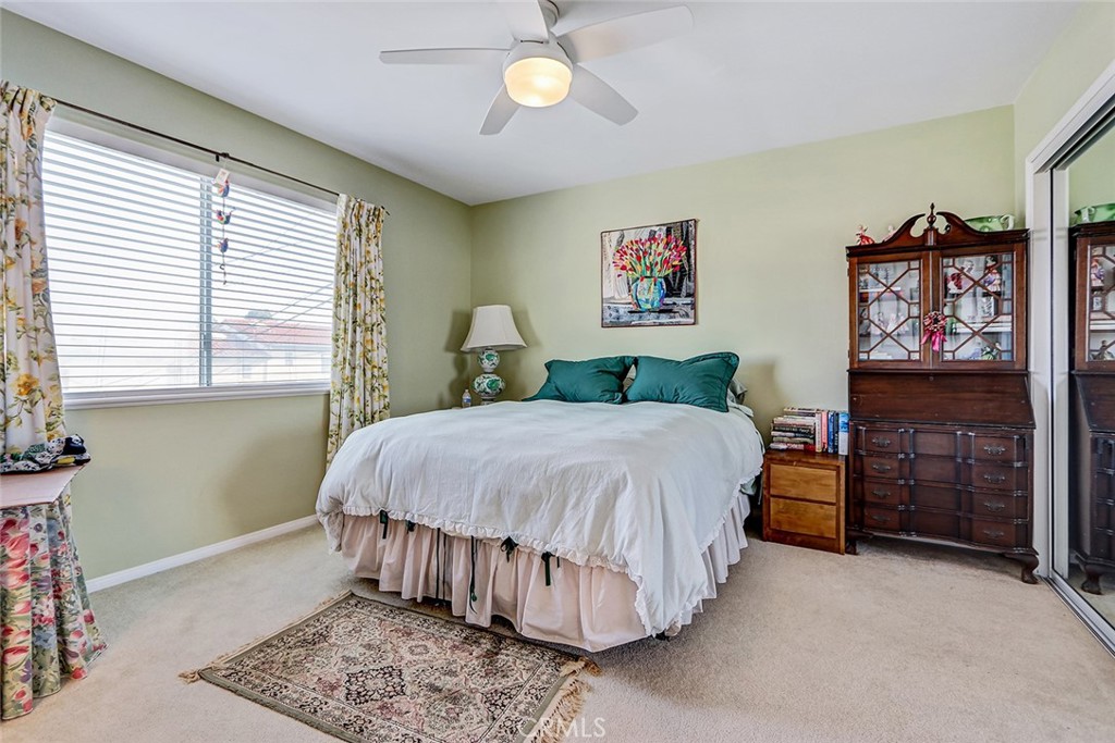 318 Penn Street, Unit 2 El Segundo, CA 90245 - Photo 17 of 28 a bedroom with a bed and a chandelier