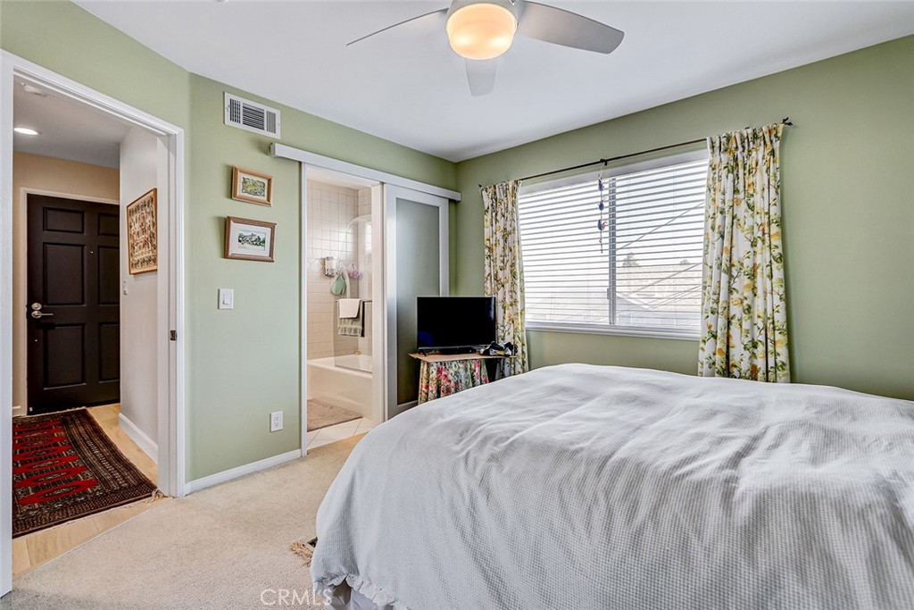 318 Penn Street, Unit 2 El Segundo, CA 90245 - Photo 19 of 28 a bedroom with a bed and a chandelier