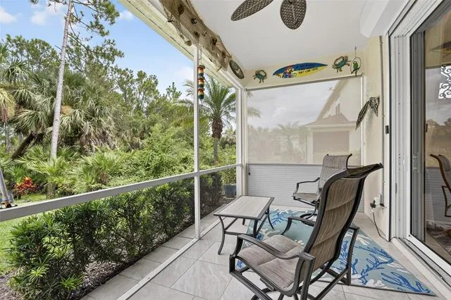a room with furniture pool table wooden floor and windows