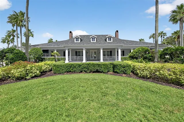 a large room with lots of furniture and wooden floor
