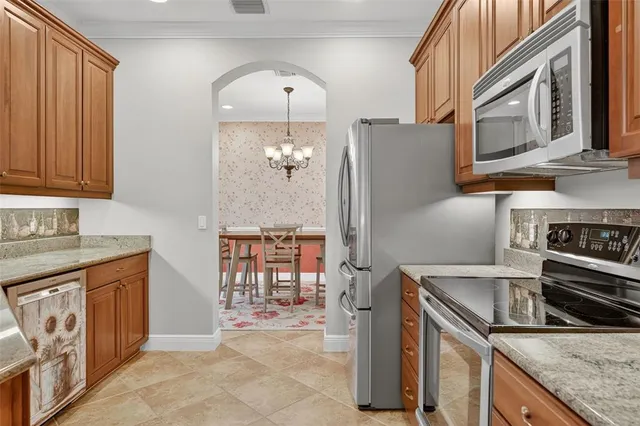 a living room with furniture a flat screen tv and a table