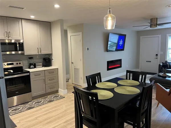 a view of a living room and dining room