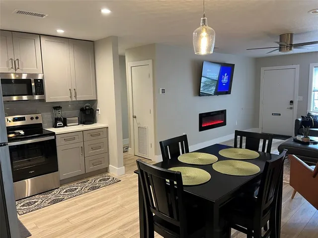 a view of a living room and dining room