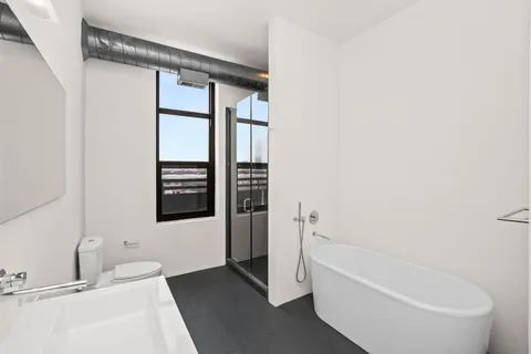 a bathroom with a bathtub and a sink