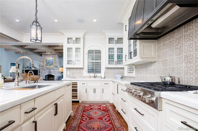 a kitchen that has a lot of cabinets in it