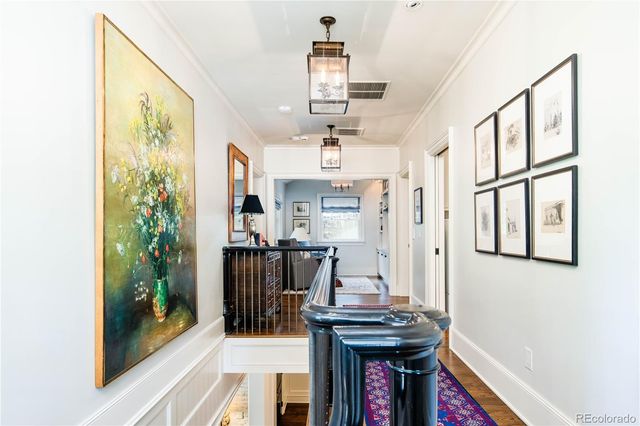 a view of a hallway with furniture and entryway
