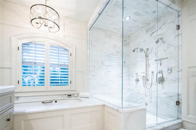 a bathroom with a sink and a shower